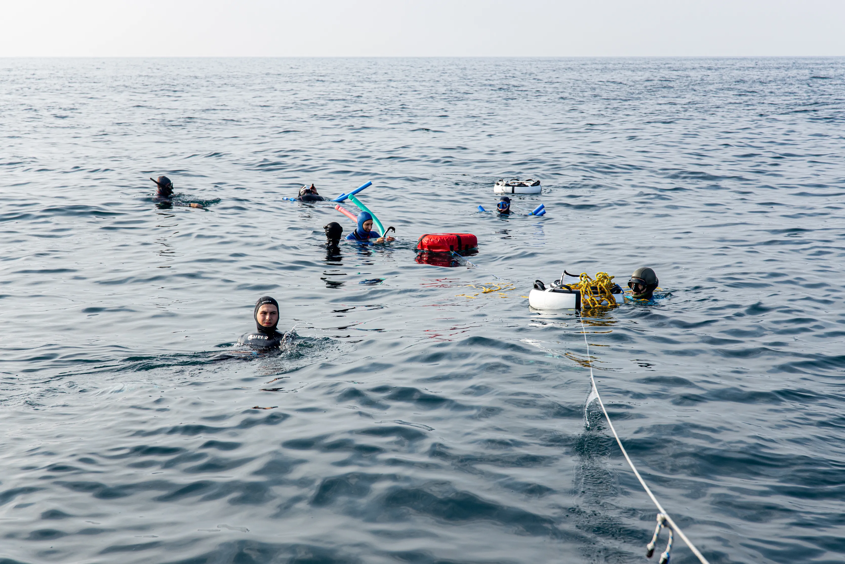 A group of freedivers are training in the sea in Dubai, UAE.