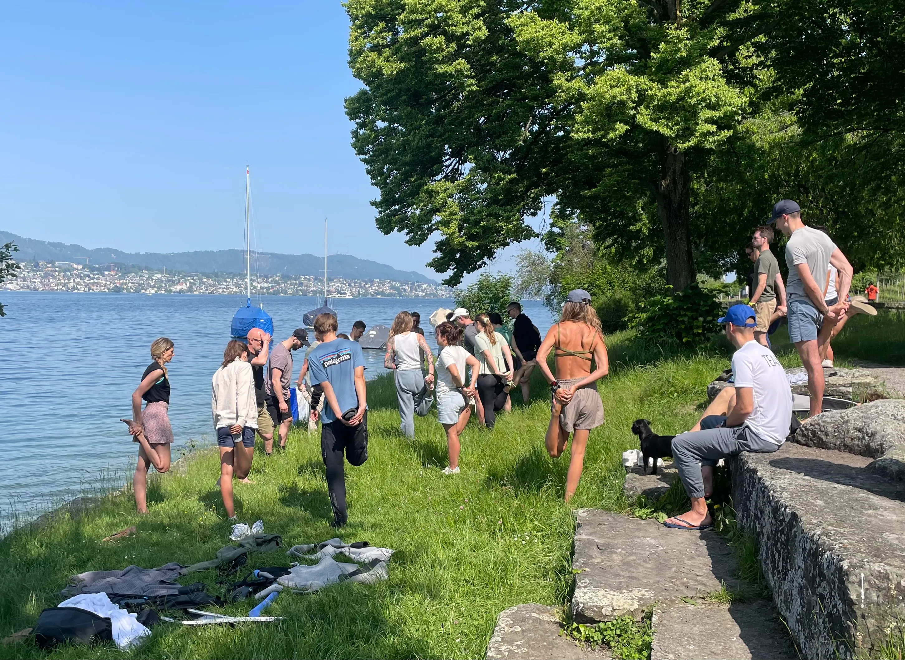 Freedivers stretching before diving in the lake in Zurich, Switzerland.